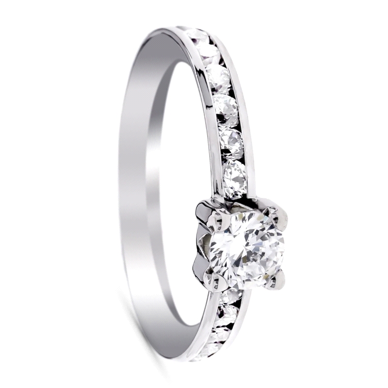Anillo solitario oro blanco 9 kilates <BR>Solitario con circonita central de 5mm y laterales con circonitas<BR>Fabricado en oro 
